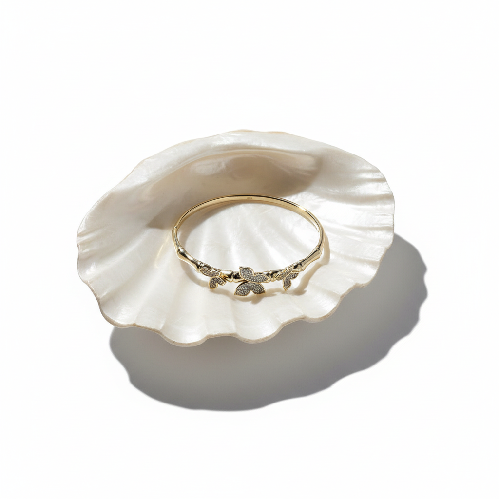 Crystal butterfly bangle bracelet flat lay gold butterfly bracelet with crystals