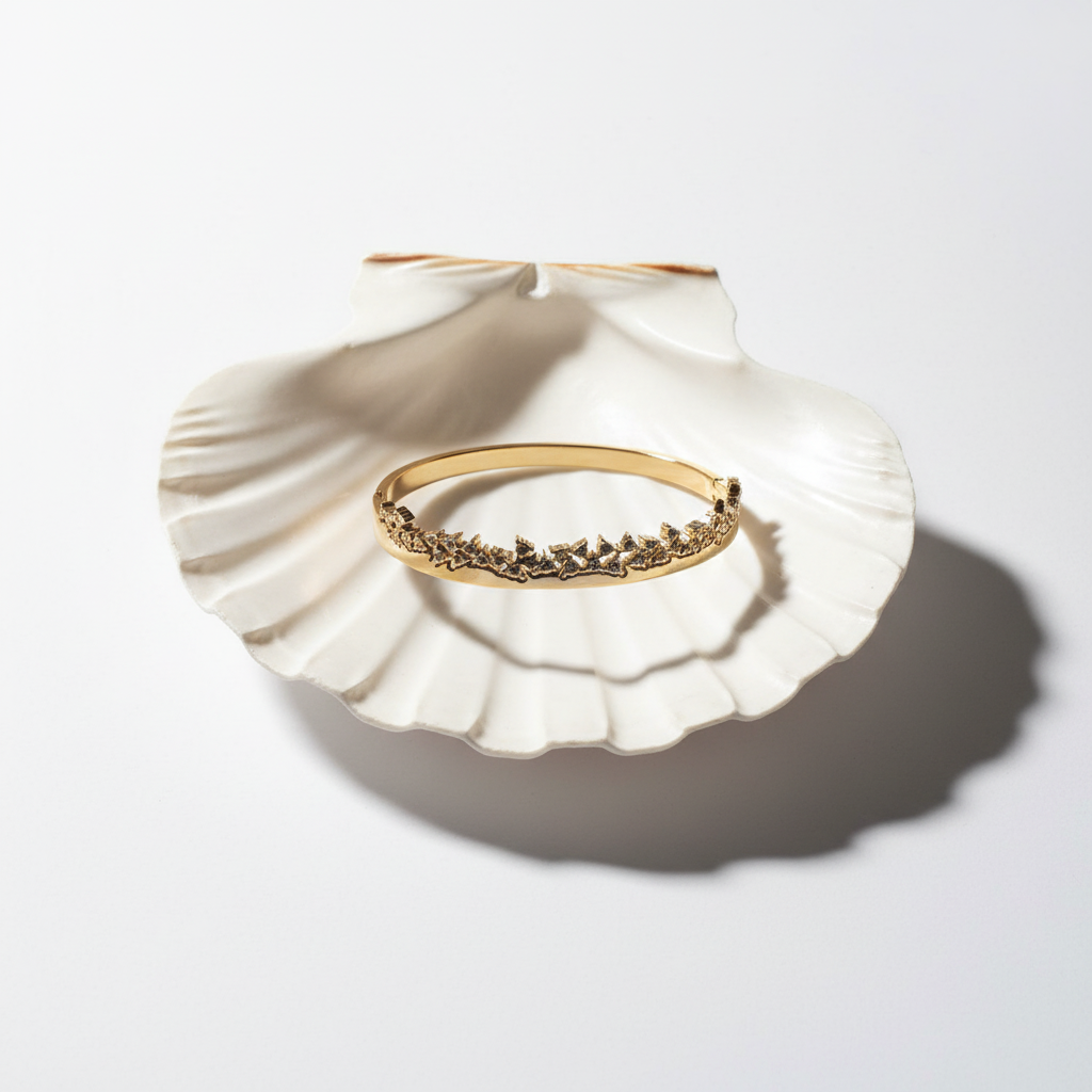 Gold crystal wave bangle bracelet flat lay crystal bangle bracelet for women