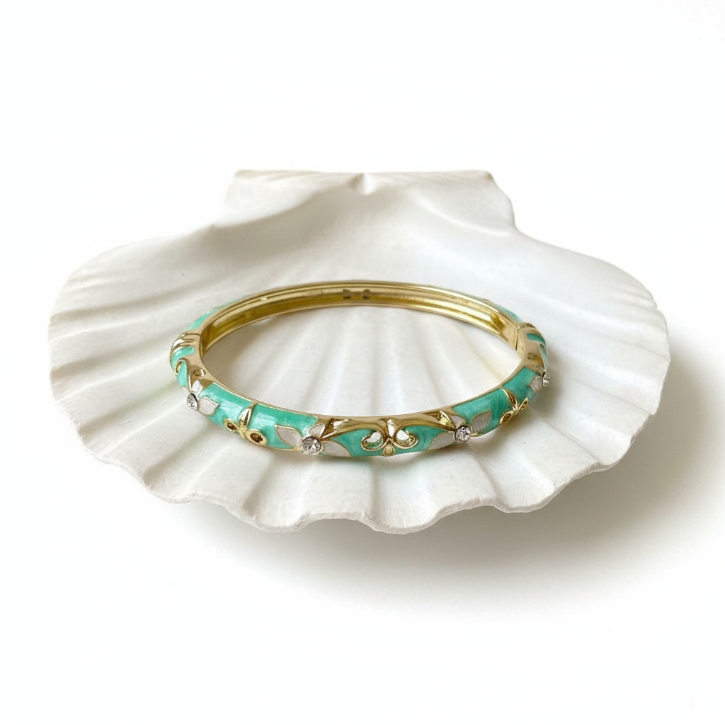 Turquoise crystal scroll enamel bangle bracelet flat lay gold enamel bracelet with white leaf design