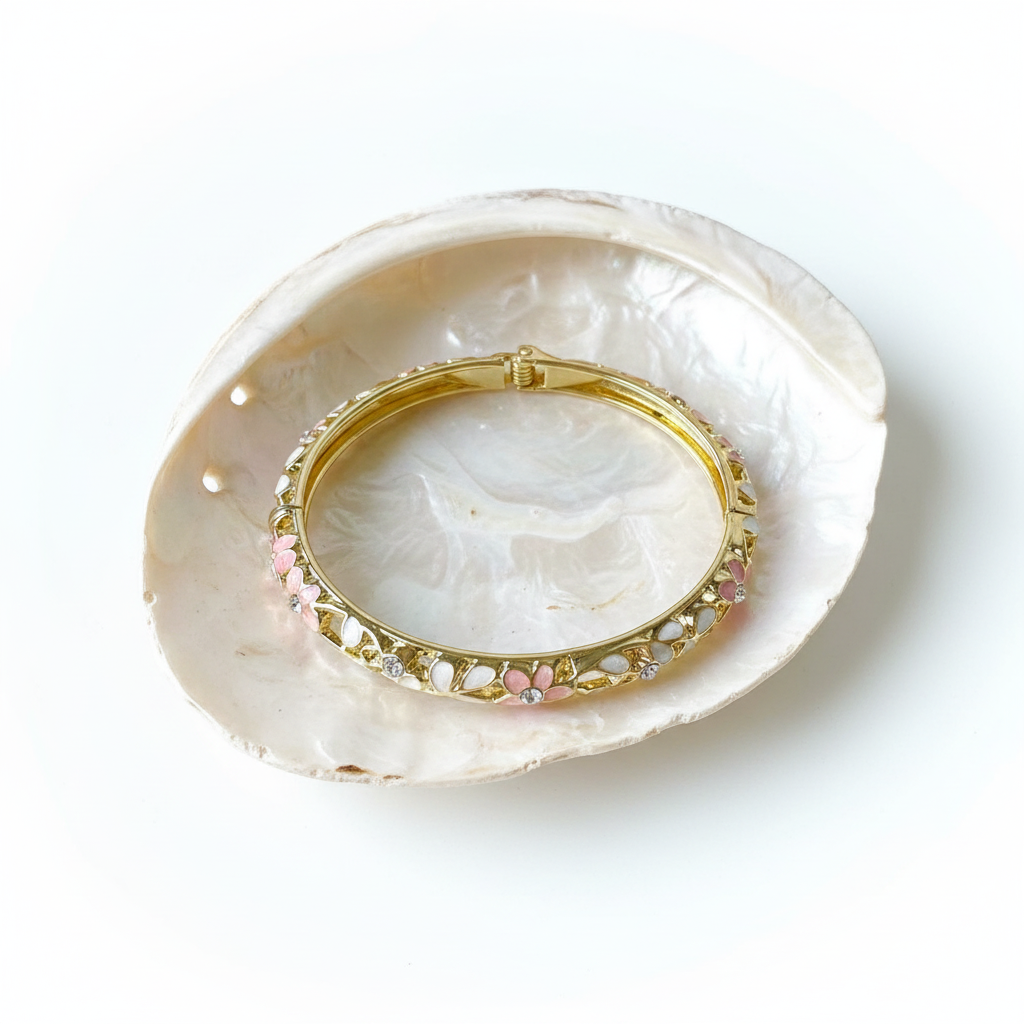 White and pink crystal petal enamel bangle bracelet flat lay gold floral enamel bracelet for women