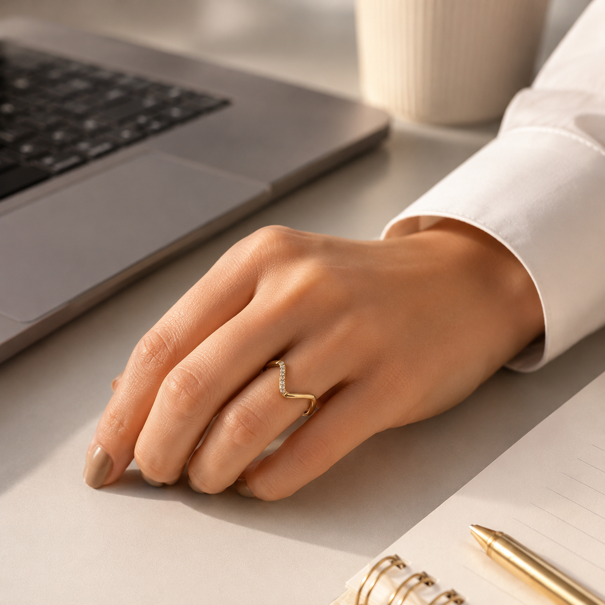 Gold V-line ring worn for office wear