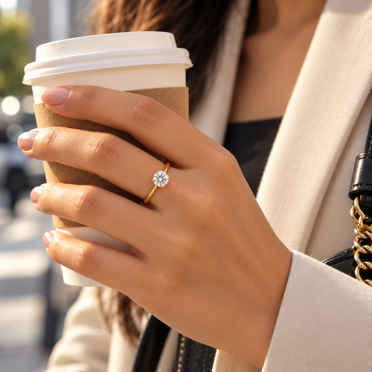 Calista Round Solitaire Ring worn while holding a coffee cup