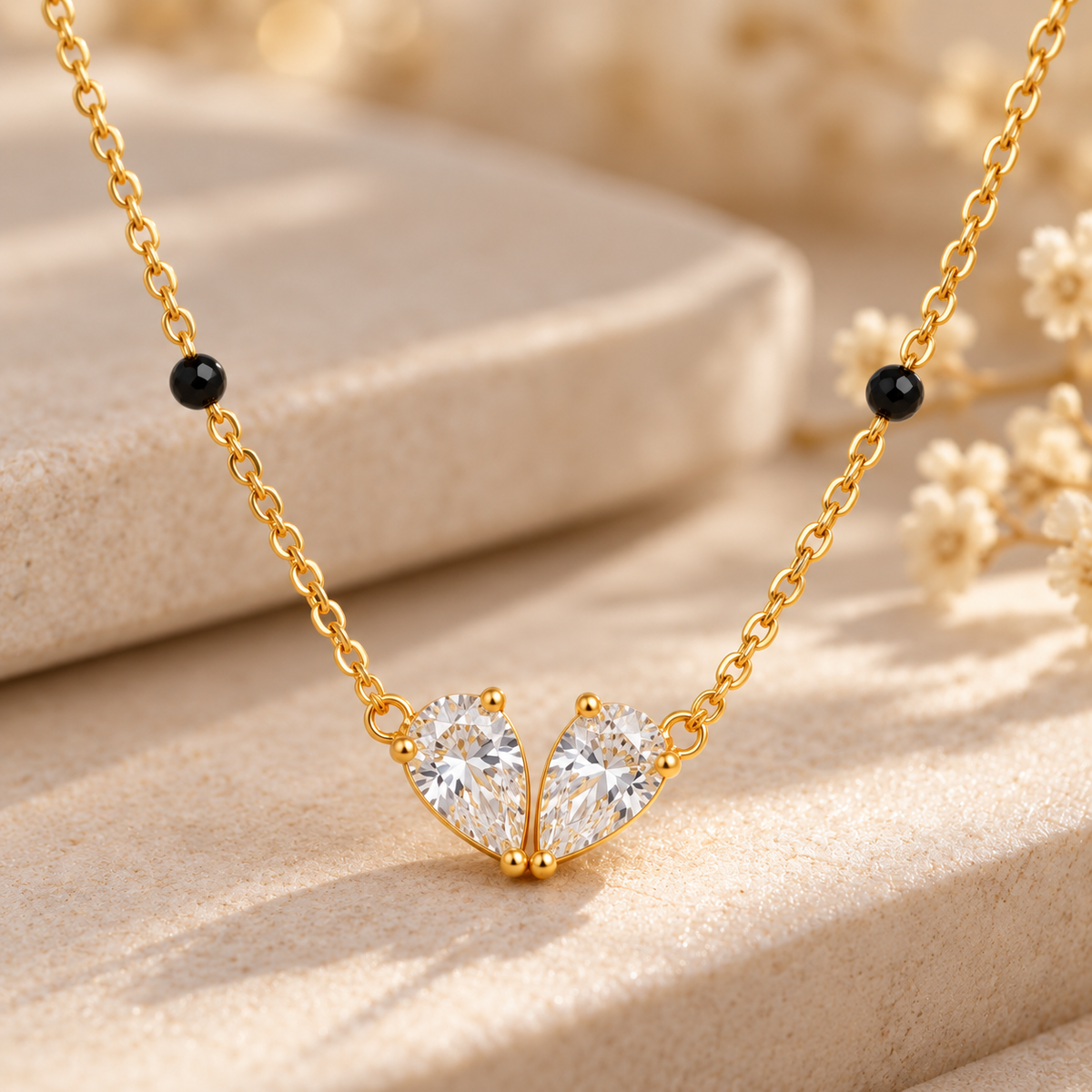Close-up of Elara mangalsutra with twin pear-cut crystal design