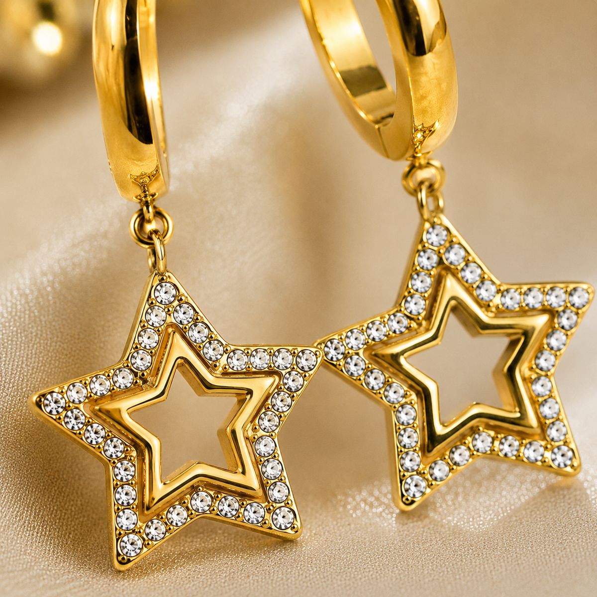 Layered star drop earrings with crystal detailing