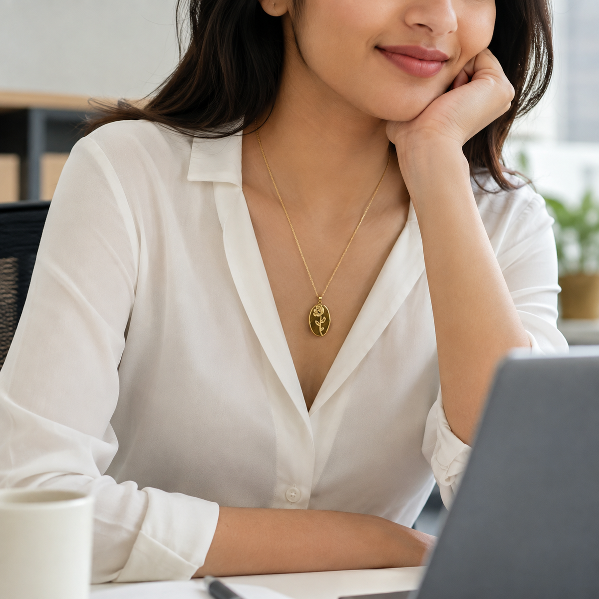 Woman wearing Elara floral necklace at office