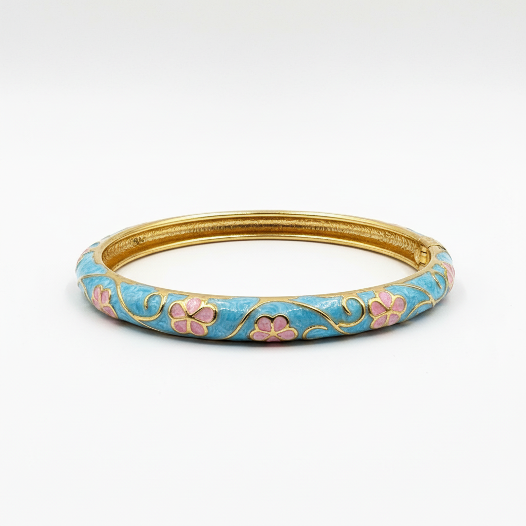 Angled side view of turquoise floral bangle