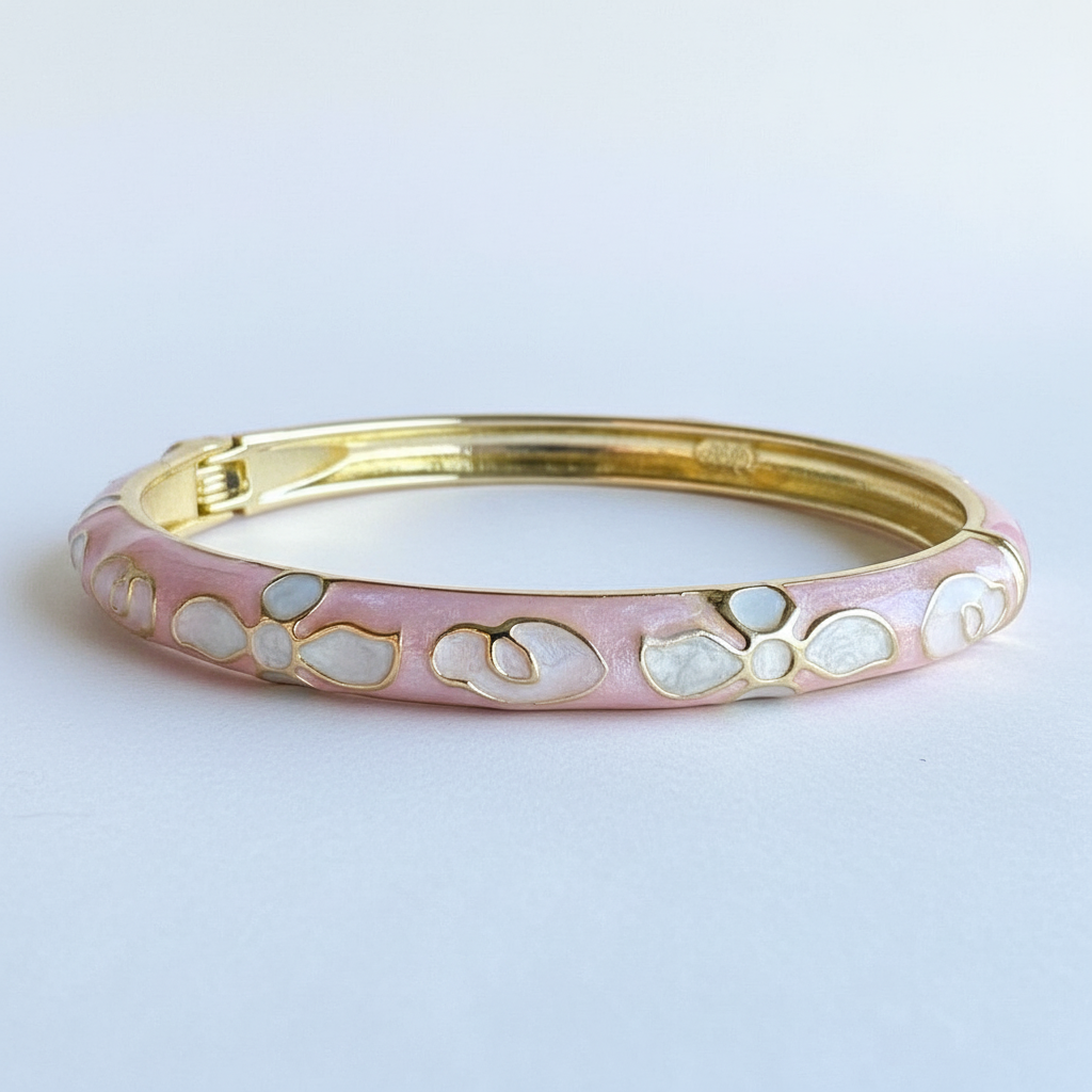 Pink petal gold plated floral enamel bracelet for women on white background