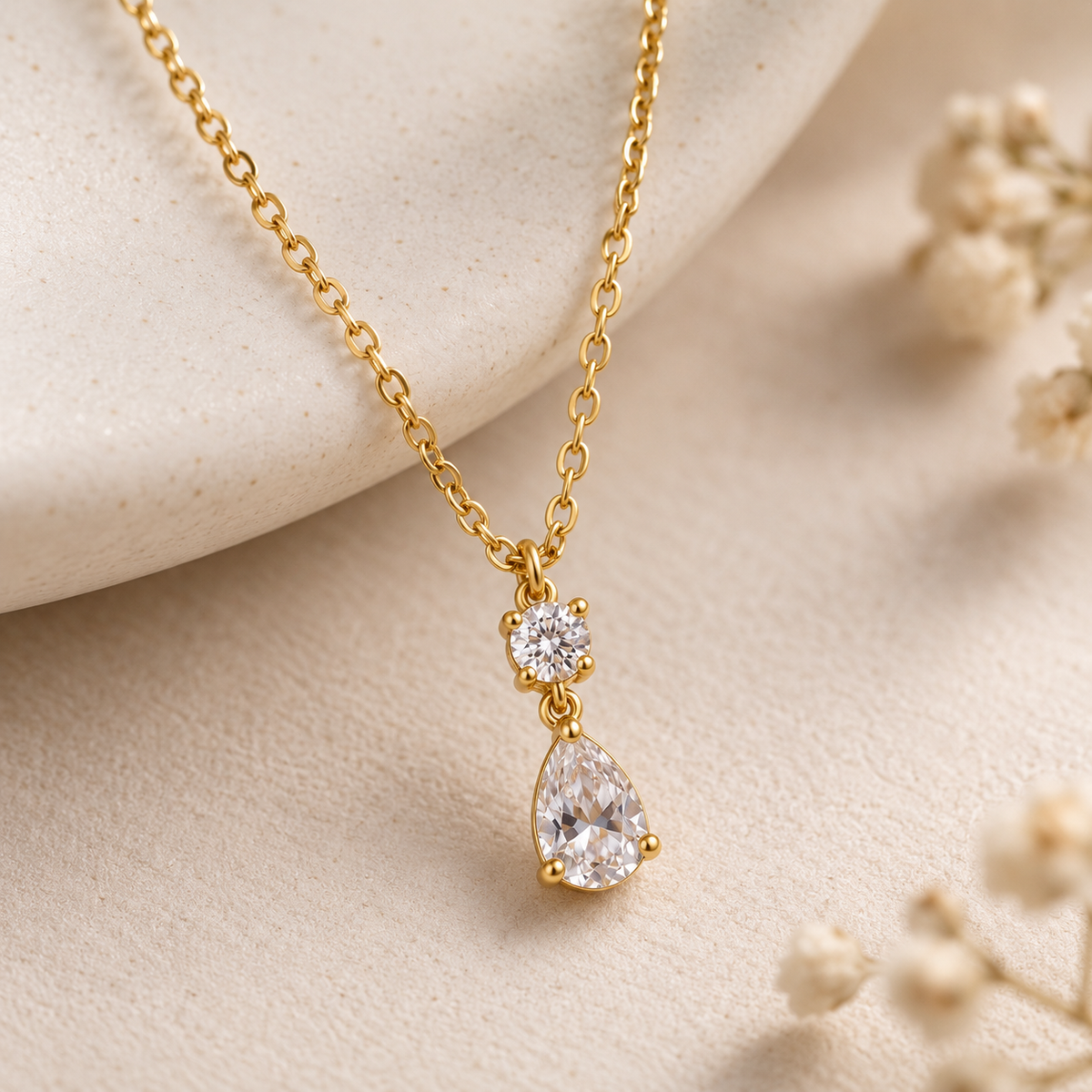 Close-up of Aveline necklace with round and pear-shaped clear crystals