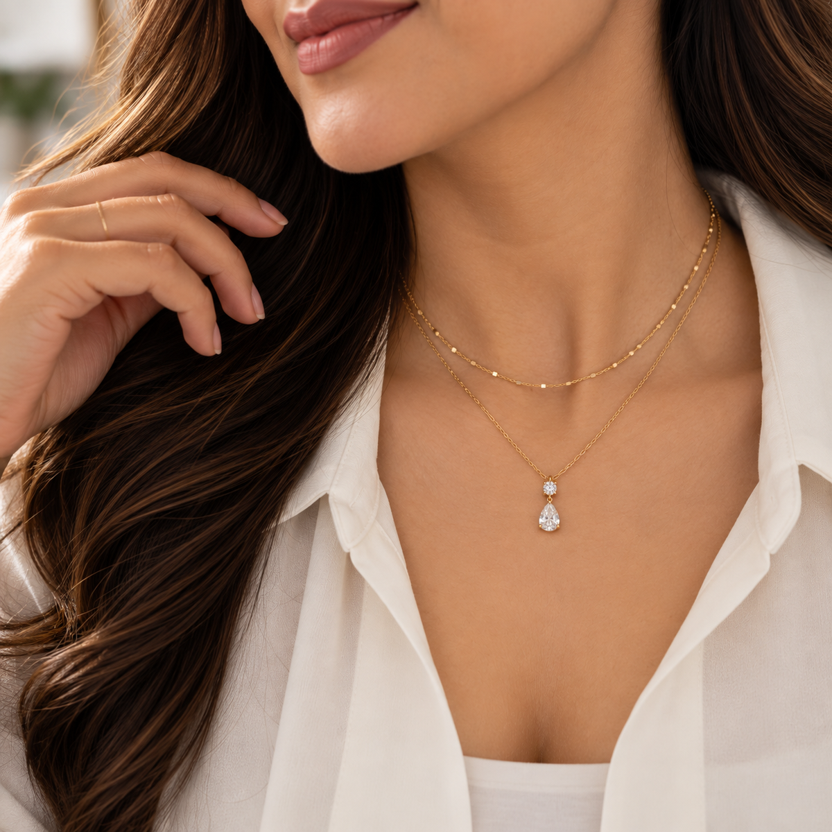 Aveline crystal drop necklace layered with a delicate gold-tone chain
