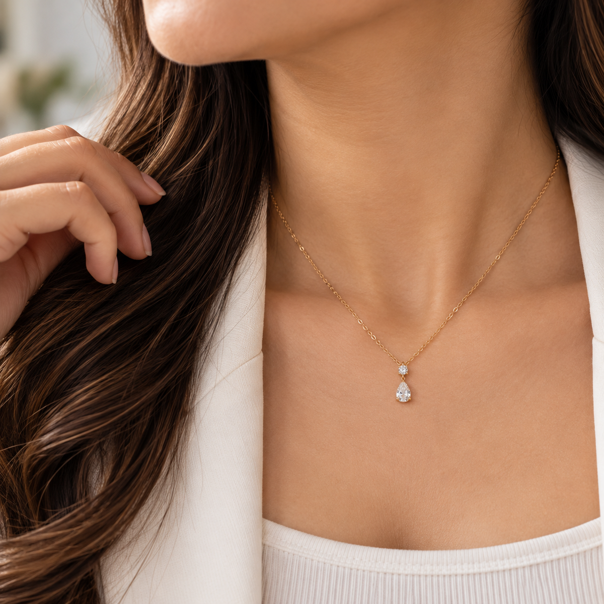 Woman wearing Aveline delicate two-stone crystal drop necklace