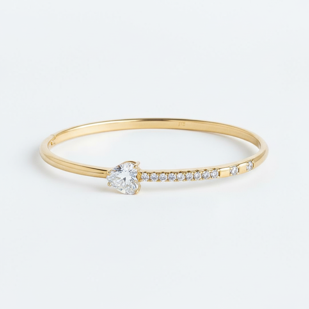 Crystal heart pave slim bangle bracelet gold plated heart bracelet for women on white background