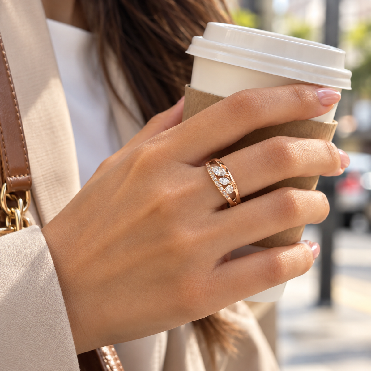 Woman wearing Elara crystal leaf ring with a coffee cup for everyday styling