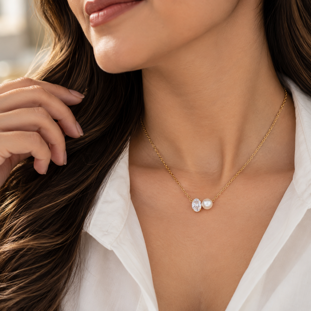 Woman wearing Elira delicate pearl and crystal necklace with an elegant minimal outfit