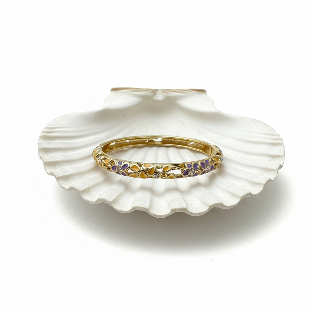 Flat lay of bangle on shell tray