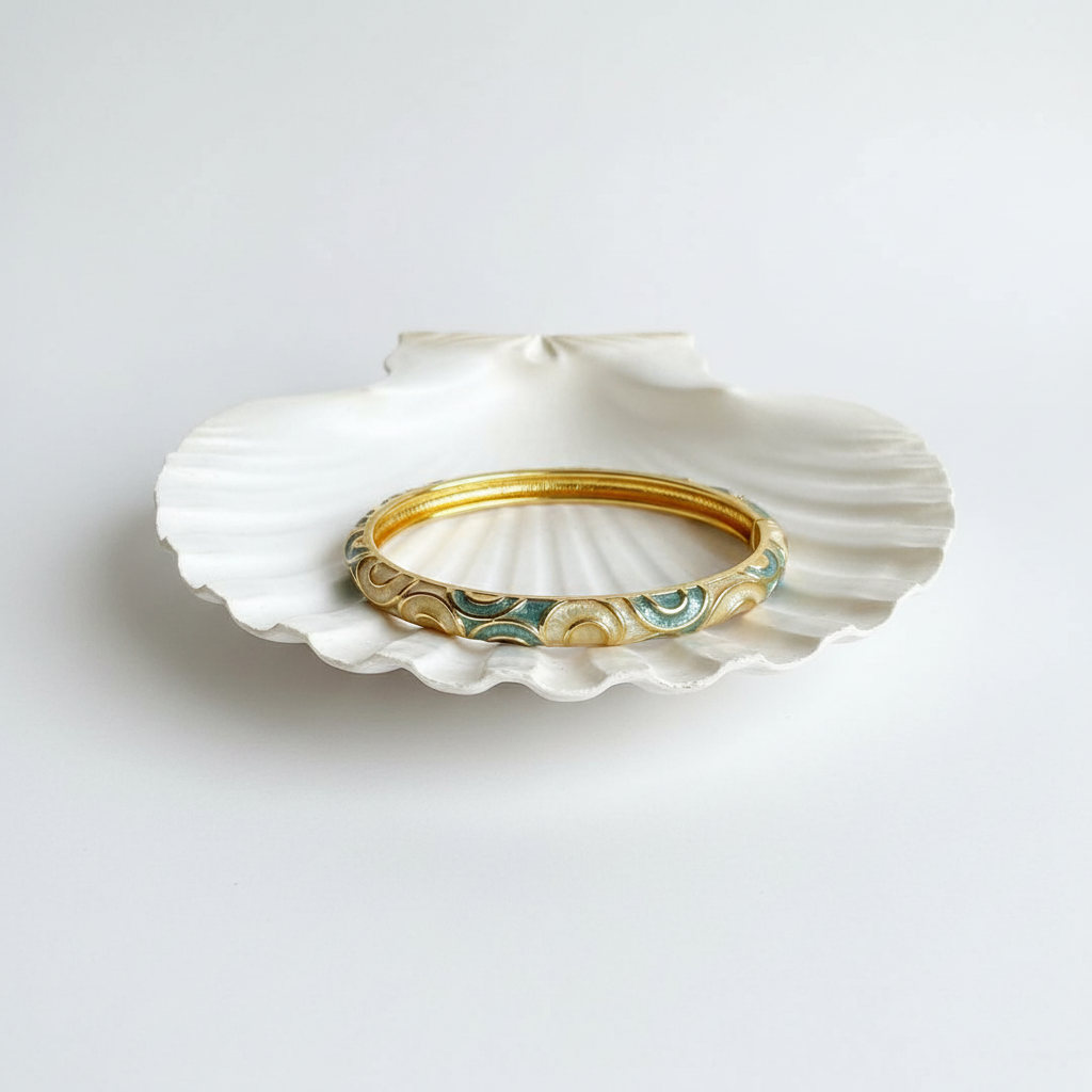 Flat lay of bangle on shell tray
