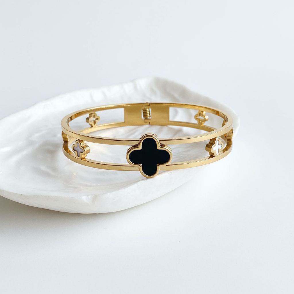 Flat lay of bangle on shell tray