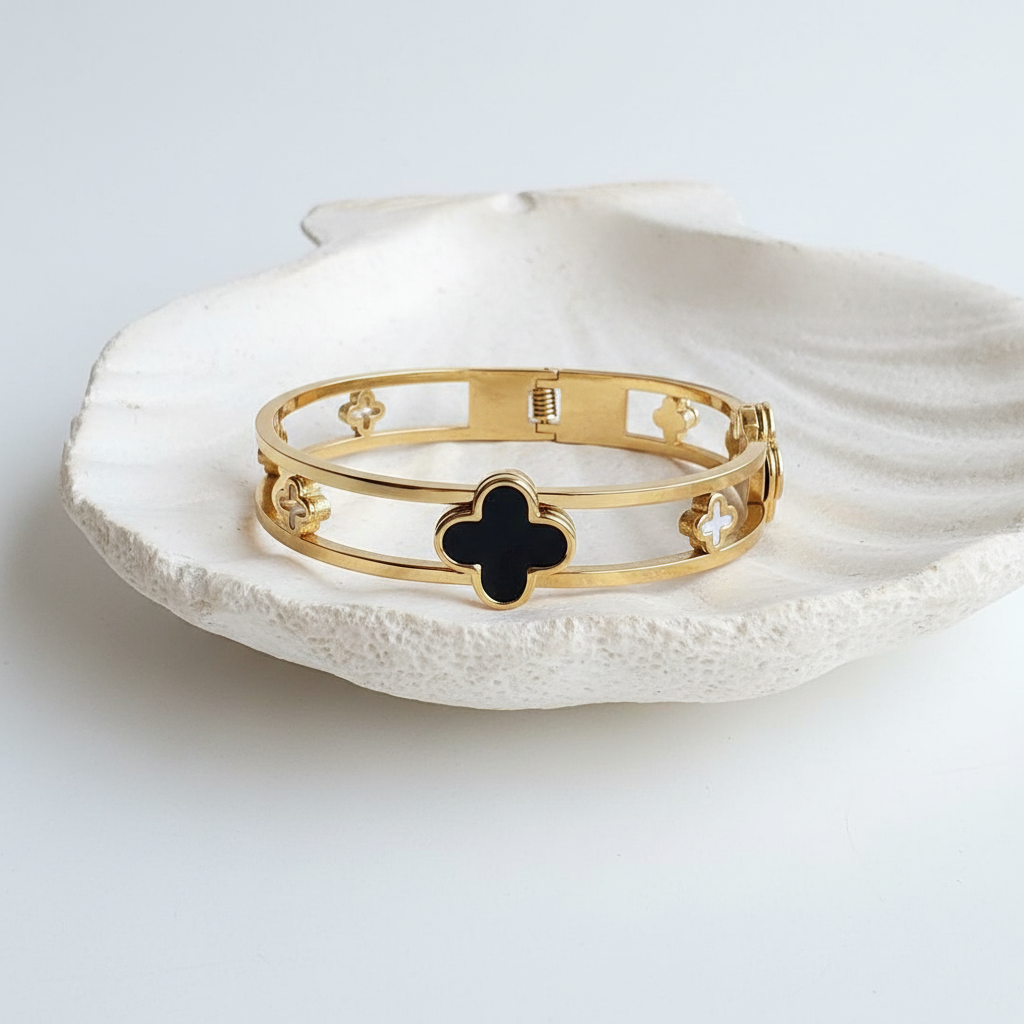 Flat lay of bangle on shell tray