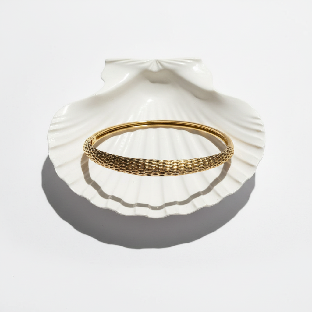Textured gold bangle bracelet flat lay minimal gold bracelet for women