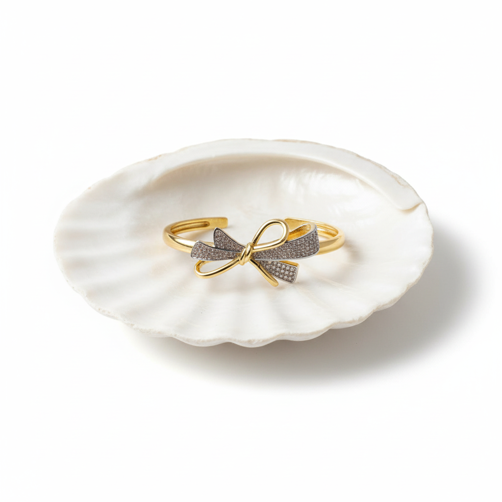 Crystal bow cuff bracelet flat lay gold bow bracelet with crystals