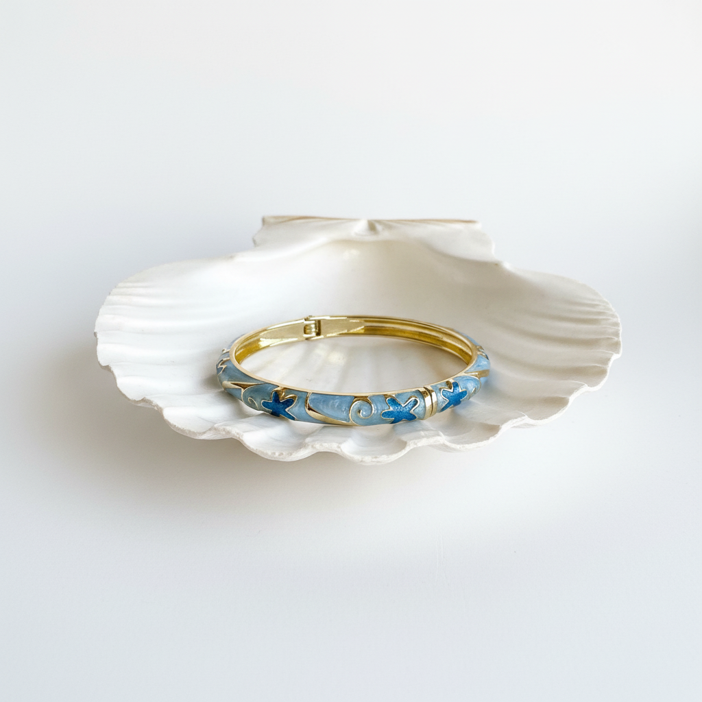 Blue floral enamel bangle bracelet flat lay gold floral enamel bracelet for women