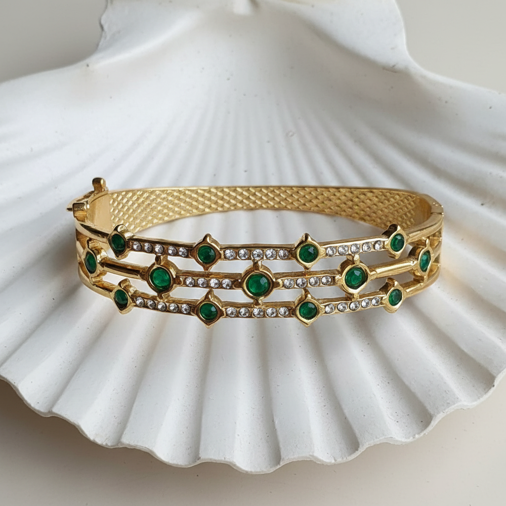 Emerald Cabochon Pavé Rail Bangle flat lay in white shell tray