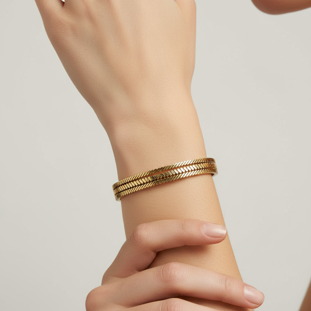 Woman wearing chevron pattern gold bangle bracelet everyday bracelet