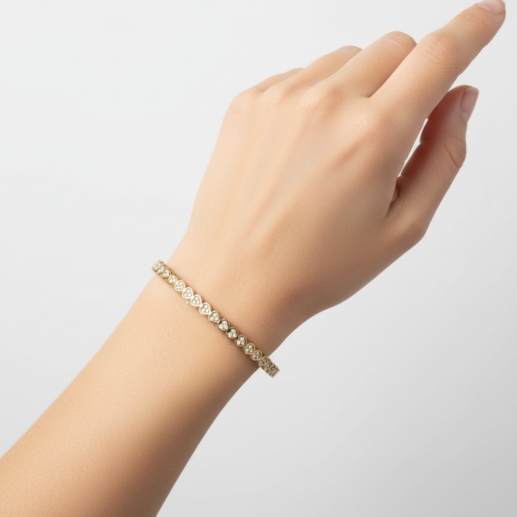 Woman wearing crystal scalloped wave slim bangle bracelet minimal gold bracelet for everyday wear