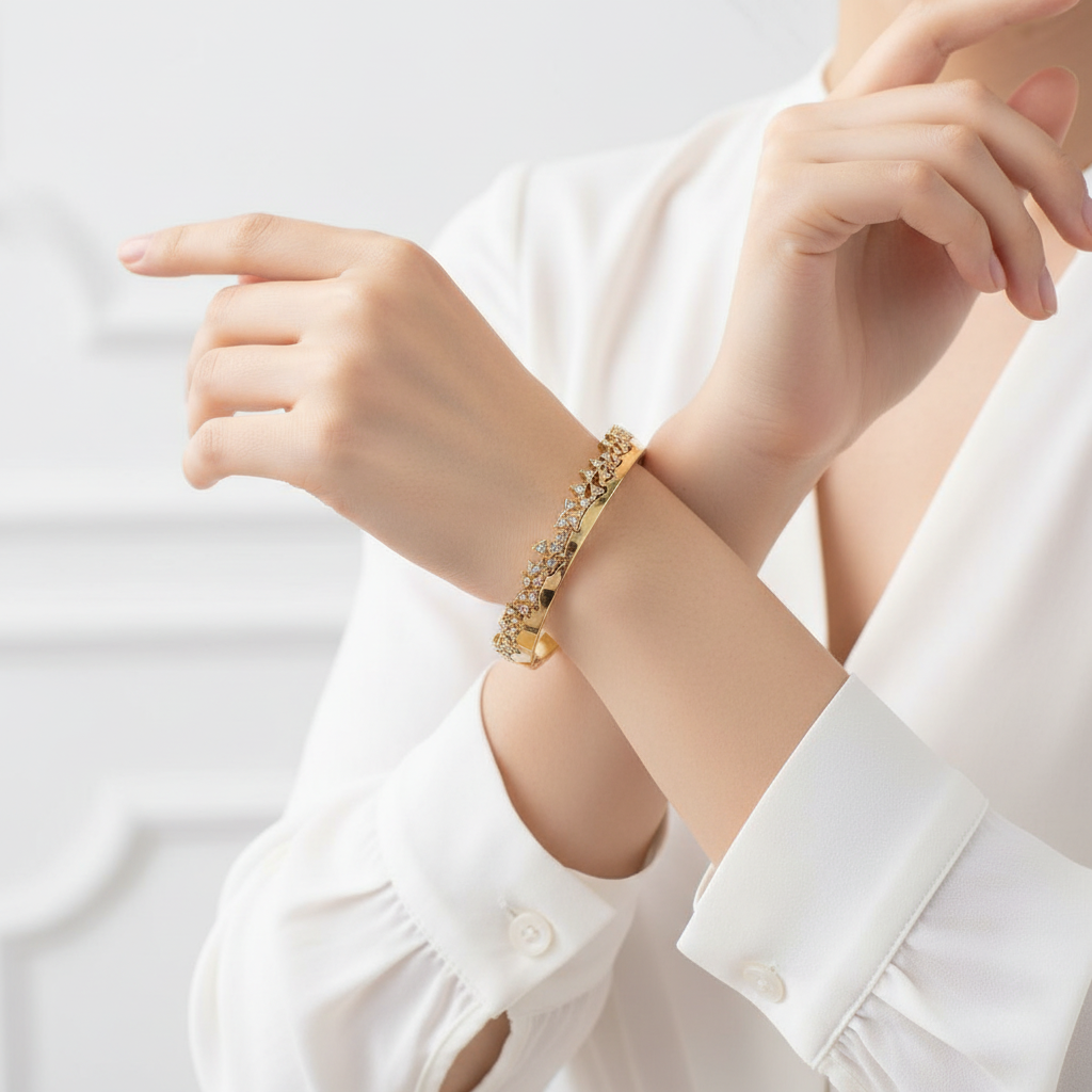 Woman wearing gold crystal wave bangle bracelet elegant everyday bracelet