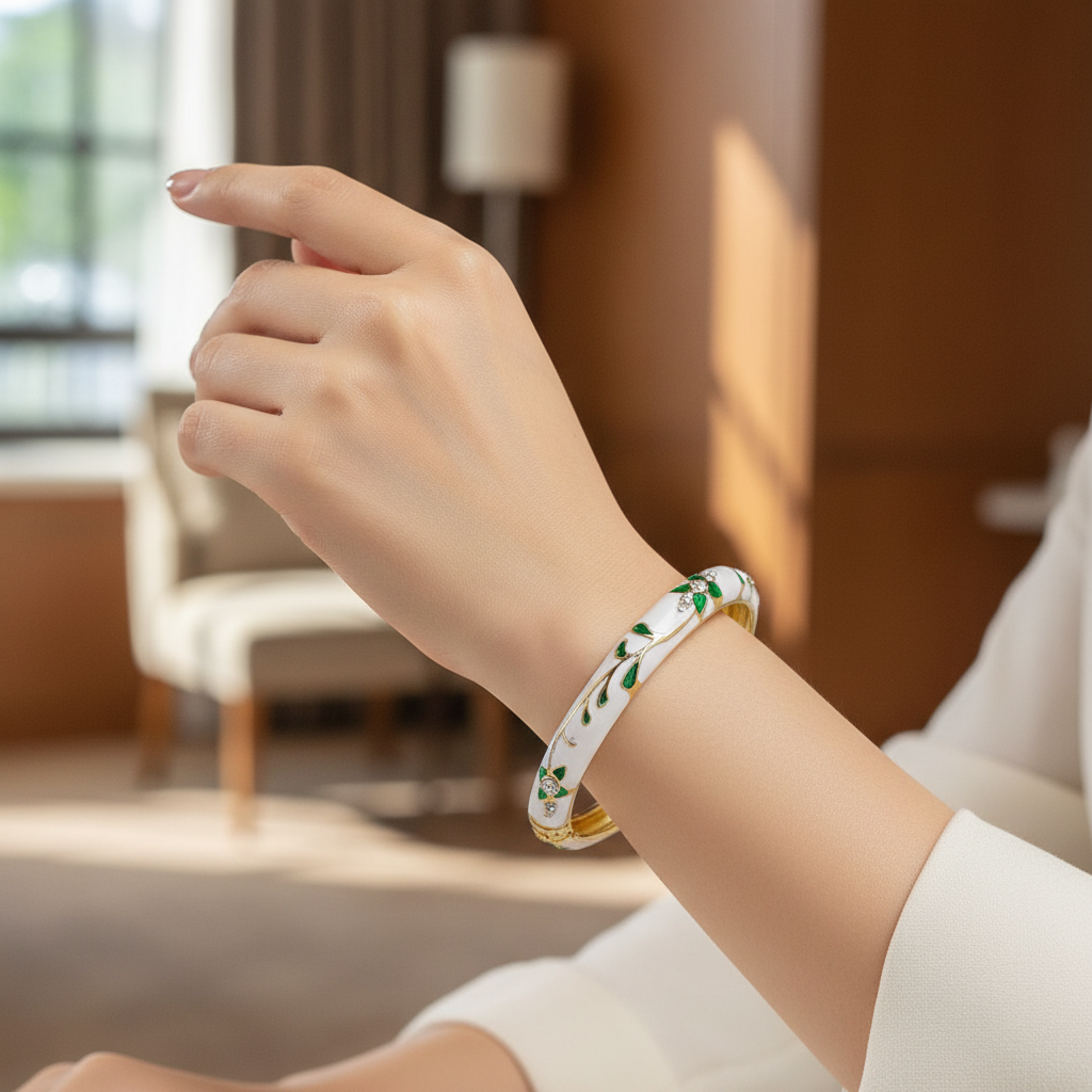 Woman wearing green leaf crystal enamel bangle bracelet minimal gold everyday bracelet