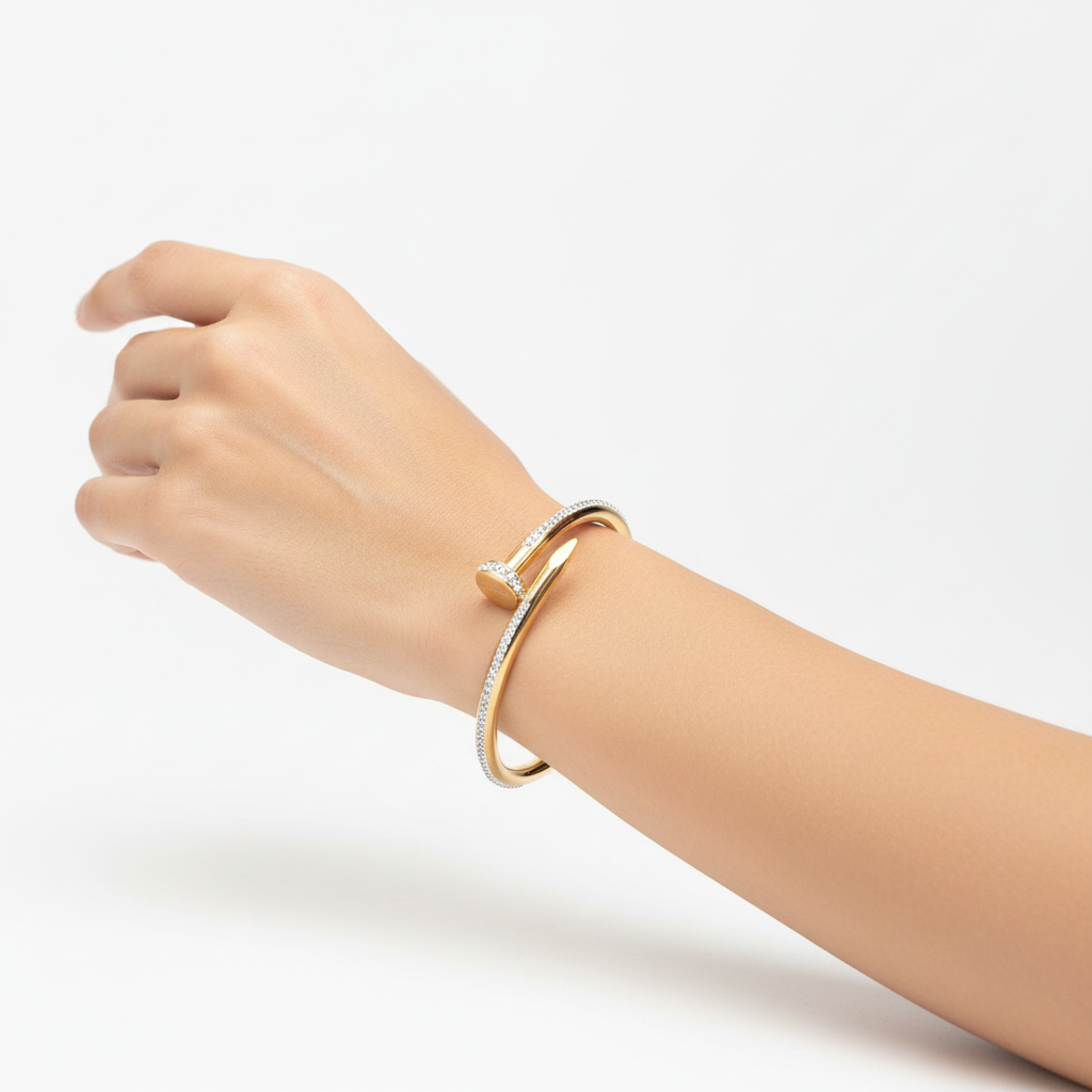 Woman wearing studded nail bracelet minimal gold bracelet for everyday wear