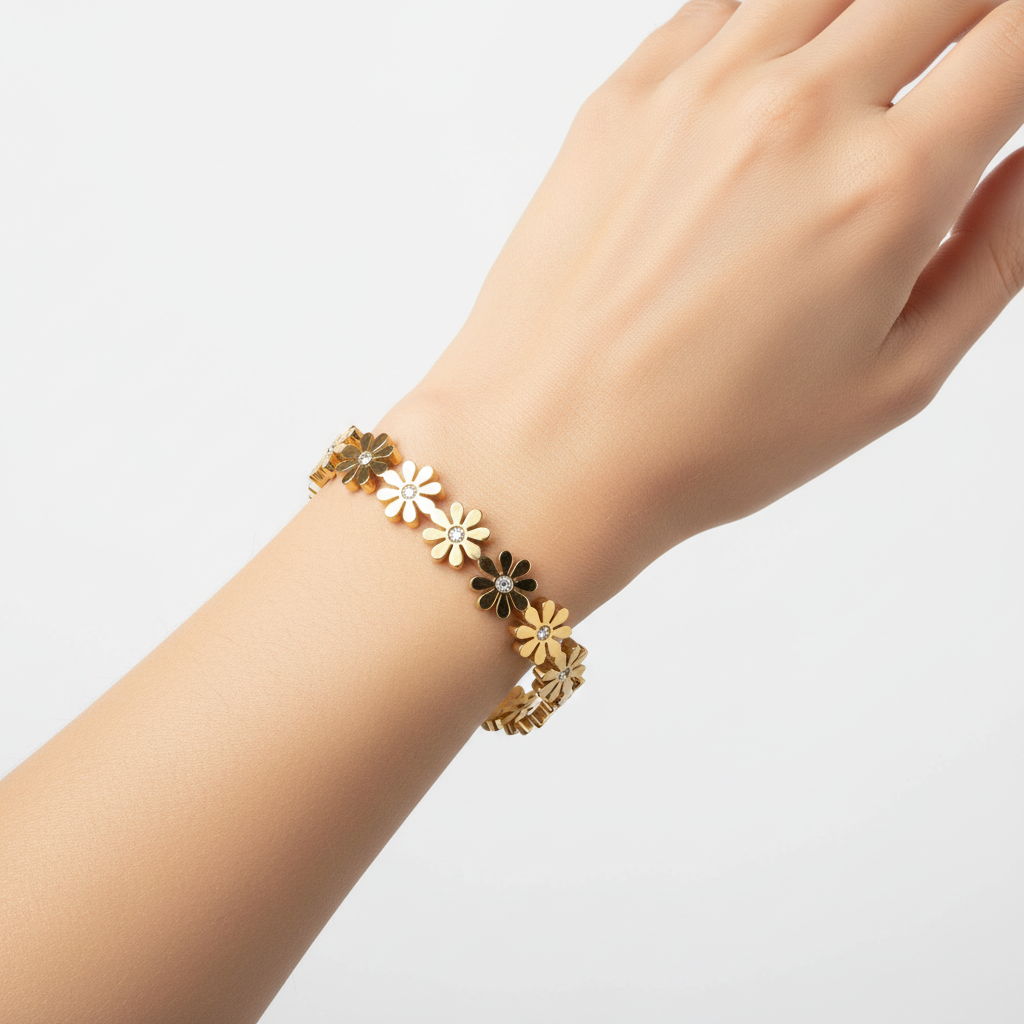 Woman wearing daisy flower bangle bracelet minimal gold floral bracelet for everyday wear