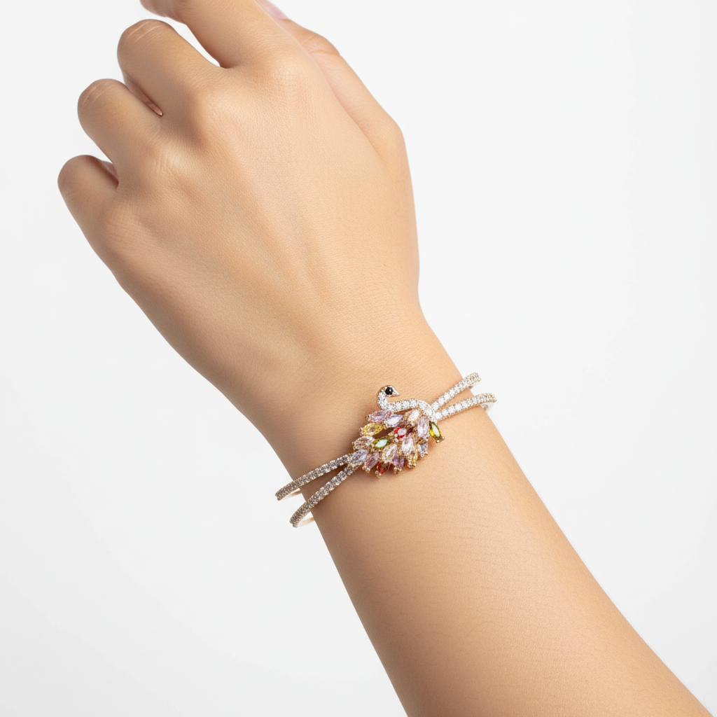 Woman wearing crystal peacock cuff bracelet elegant gold bracelet for everyday wear