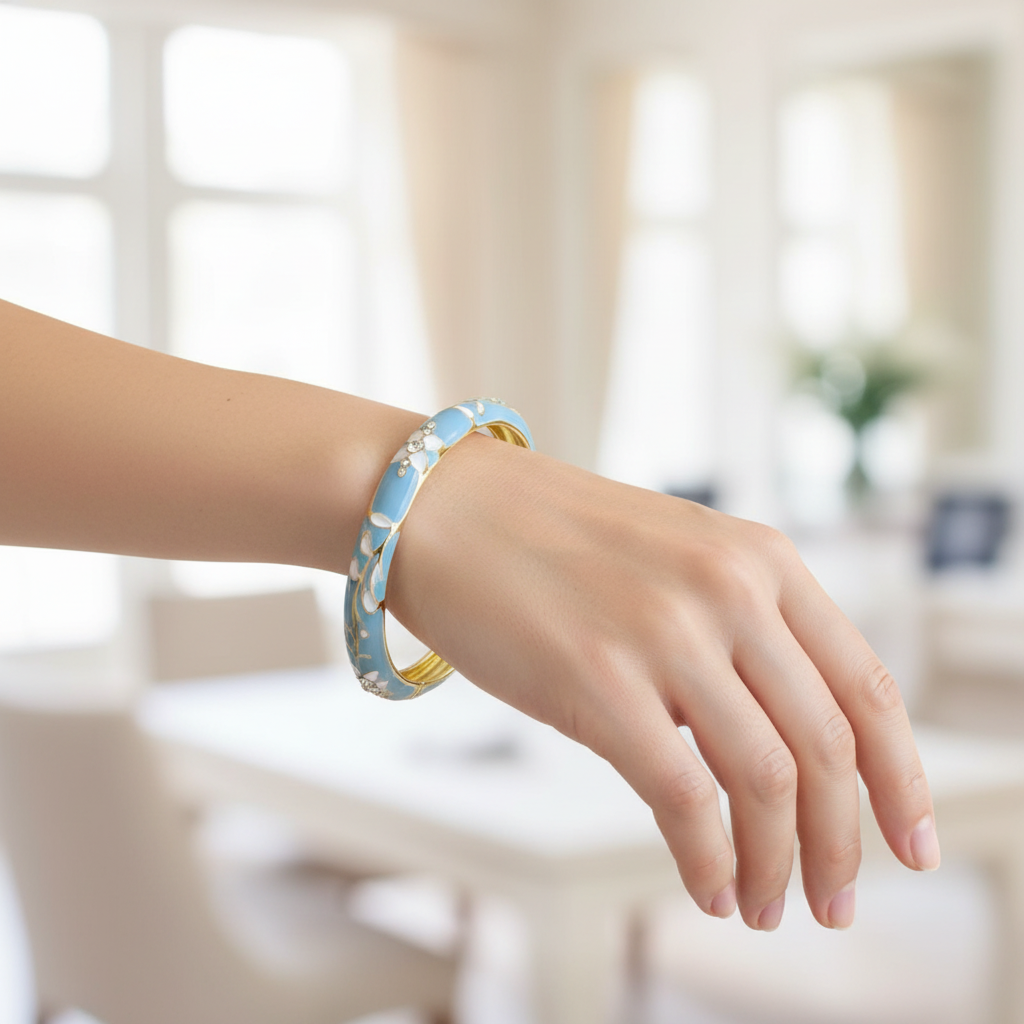 Woman wearing sky blue crystal floral enamel bangle bracelet minimal gold bracelet for everyday wear