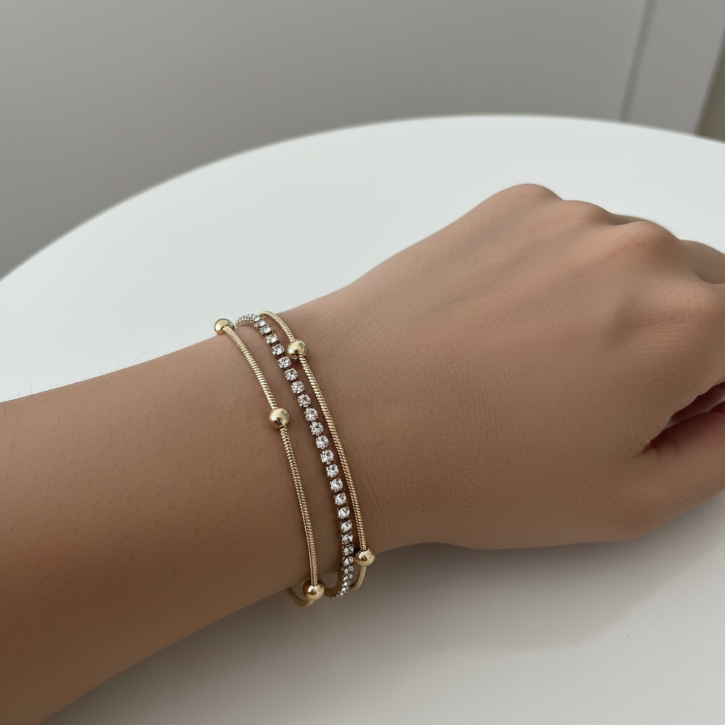 Triple strand crystal gold bead bracelet layered gold bracelet for women on white background