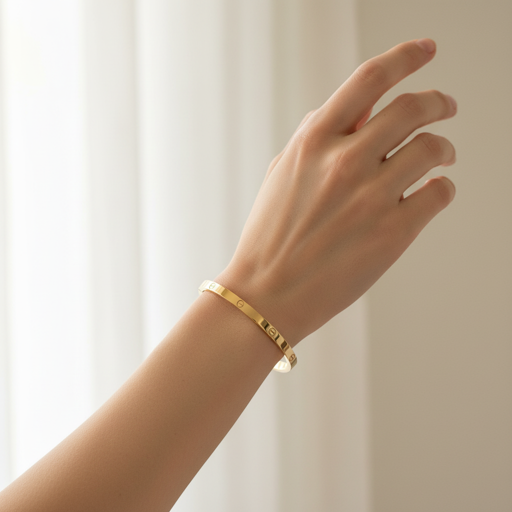 Woman wearing slim screw bangle bracelet minimal gold everyday bracelet for office wear